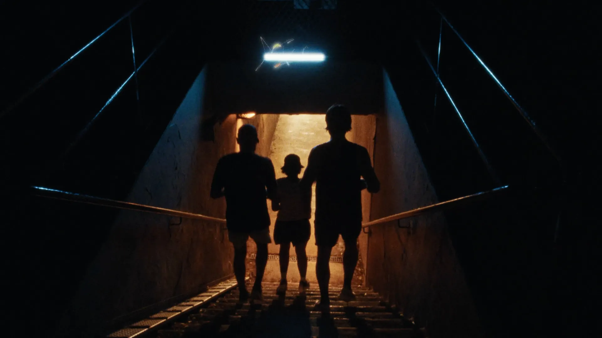 Man walking through a tunnel with dramatic lighting, Summer Nights urban exploration