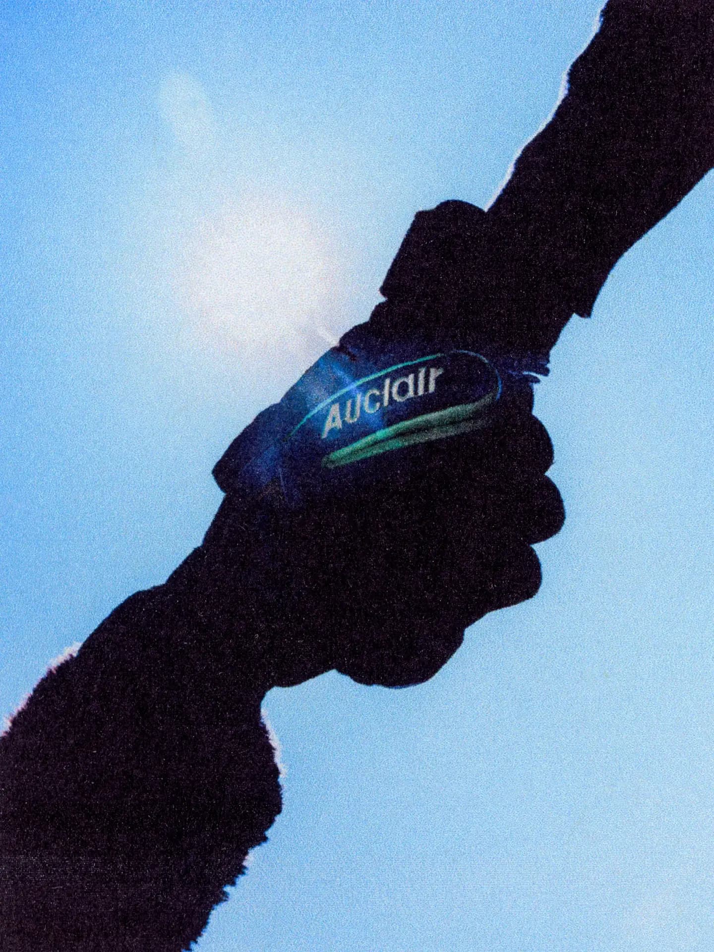 Close-up of hands wearing Auclair gloves with wristwatch, winter accessories detail
