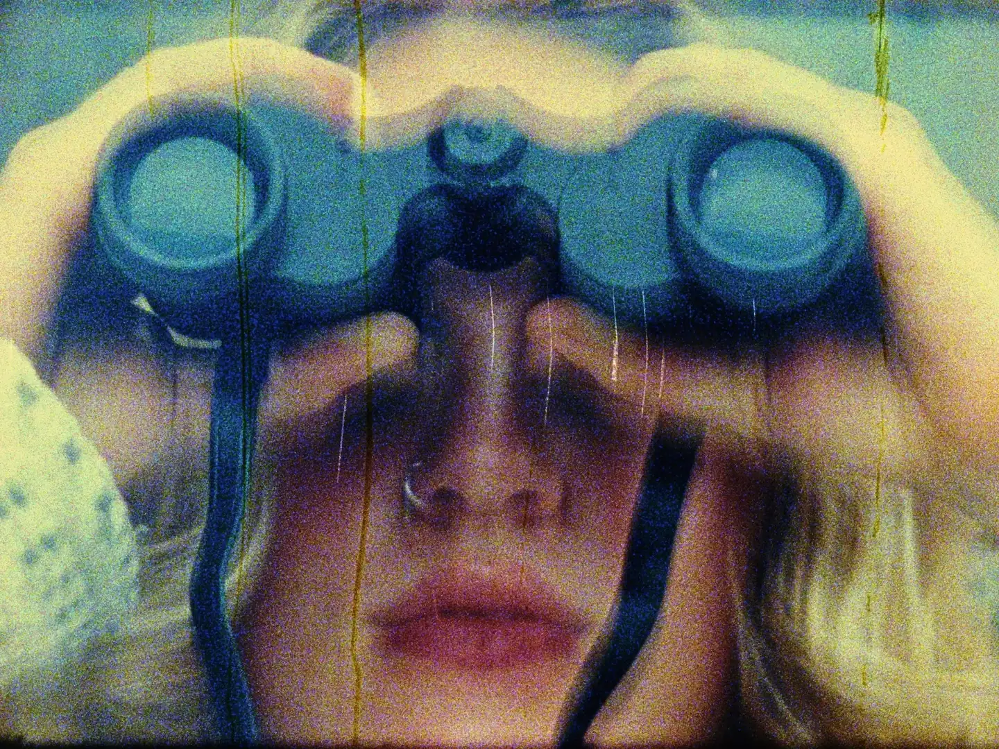 Person looking through binoculars, Jay project exploration photography