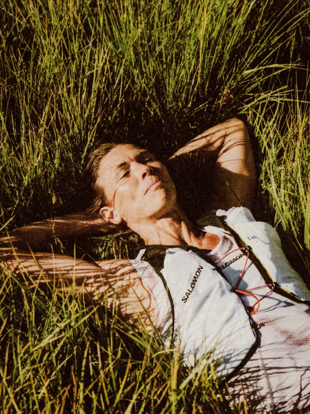 Person resting on grass after race effort, Western States ultramarathon recovery