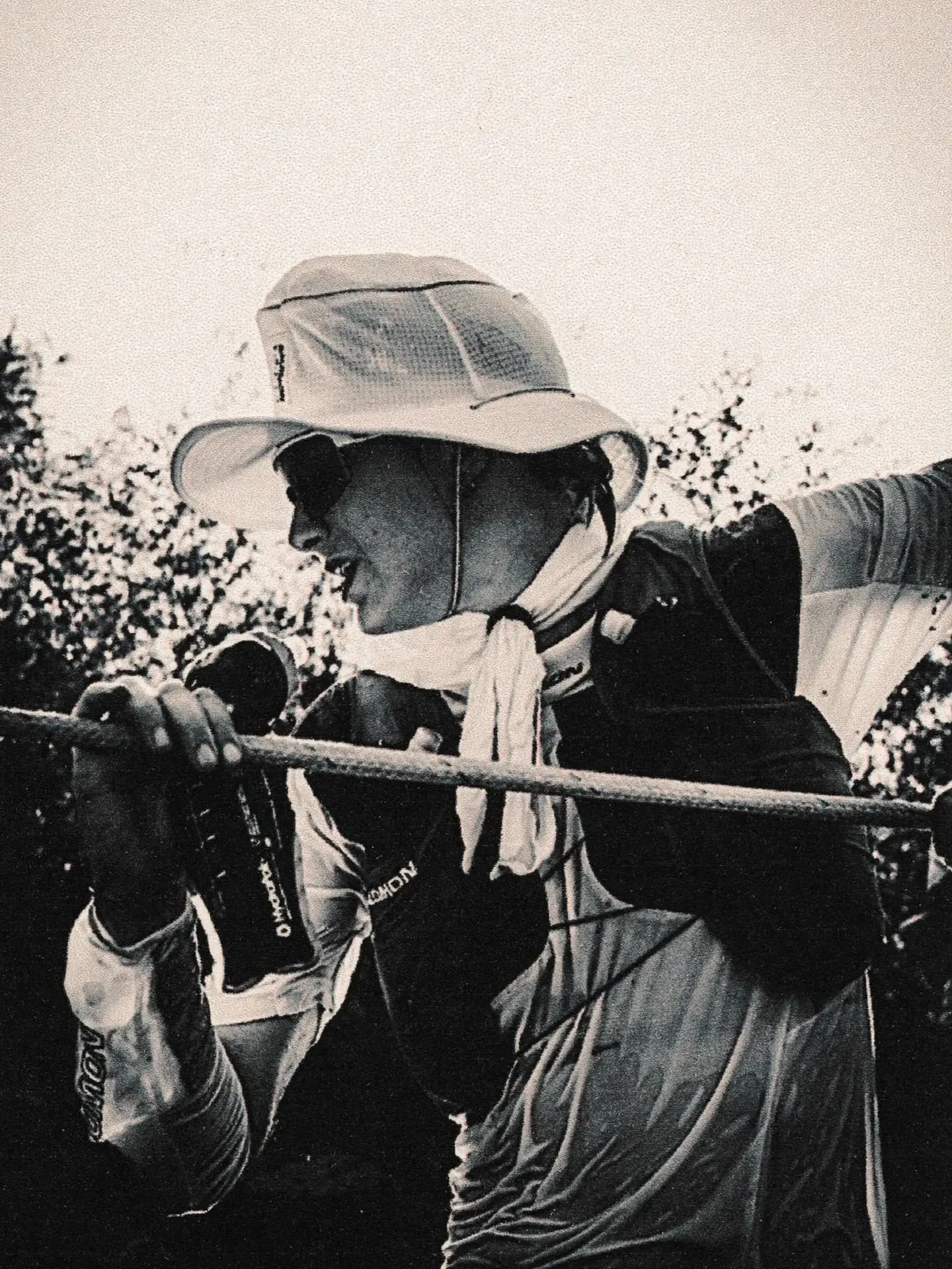 Man in baseball hat portrait among people, Western States race crowd photography