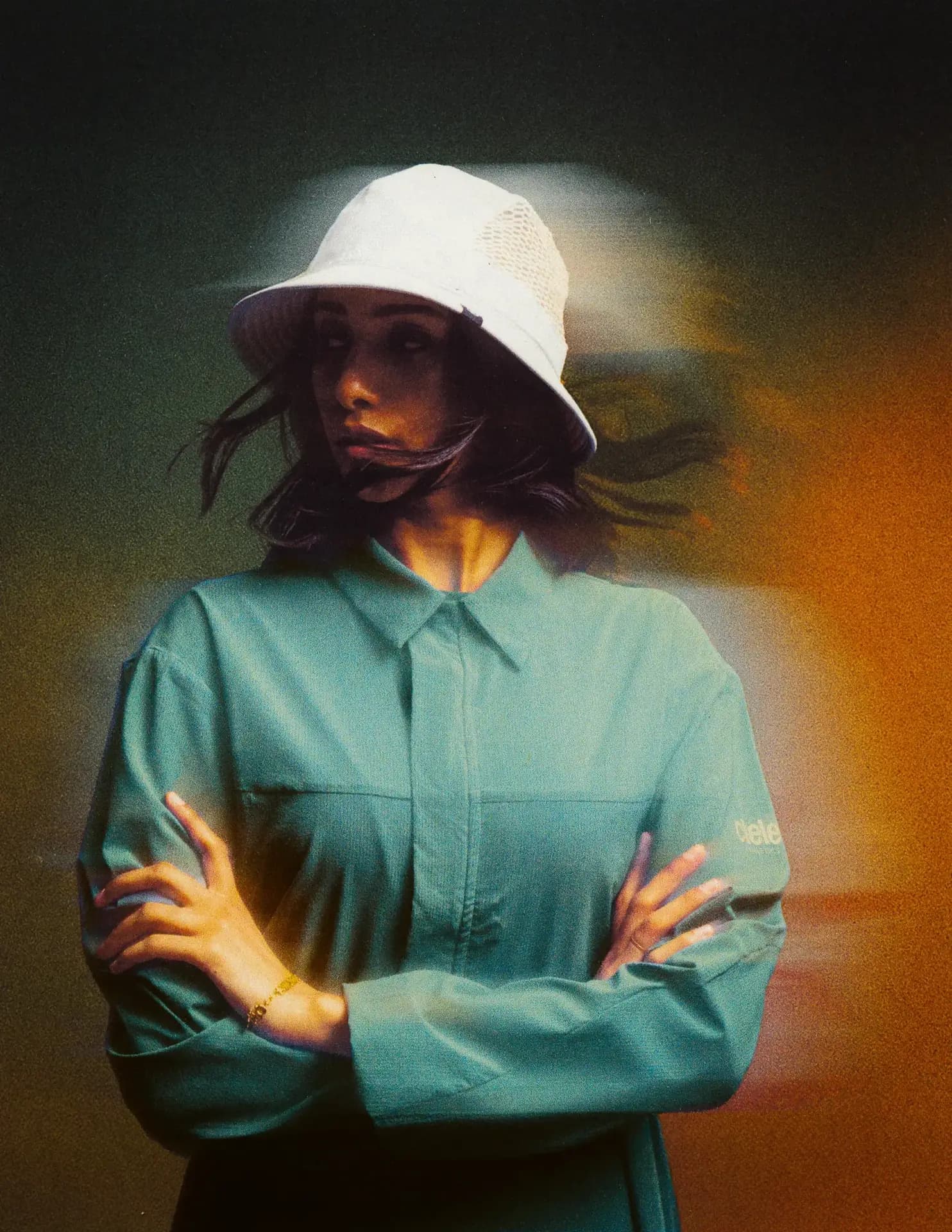 Woman wearing Ciele Le sun hat with bracelet, portrait photography